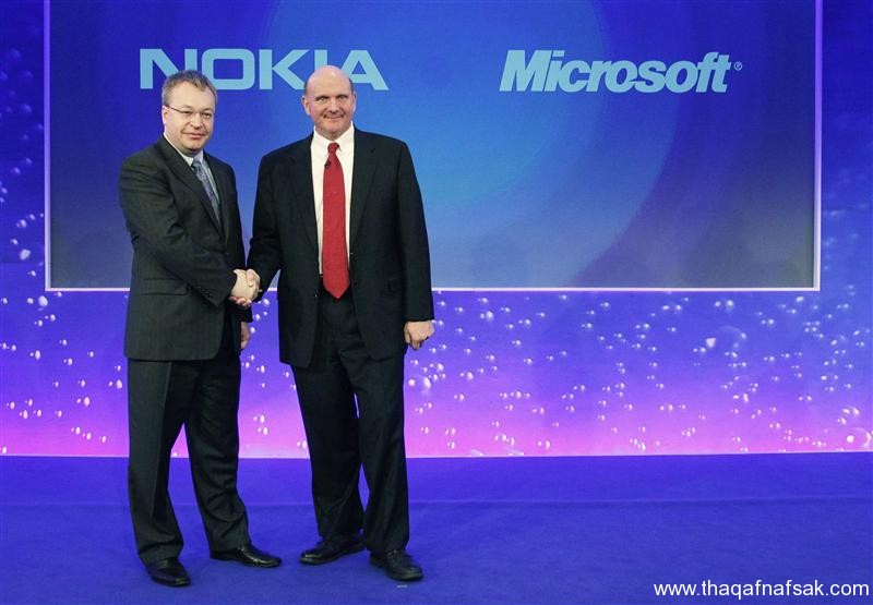 File photo of Nokia chief executive Stephen Elop welcoming Microsoft chief executive Steve Ballmer with a handshake at a Nokia event in London